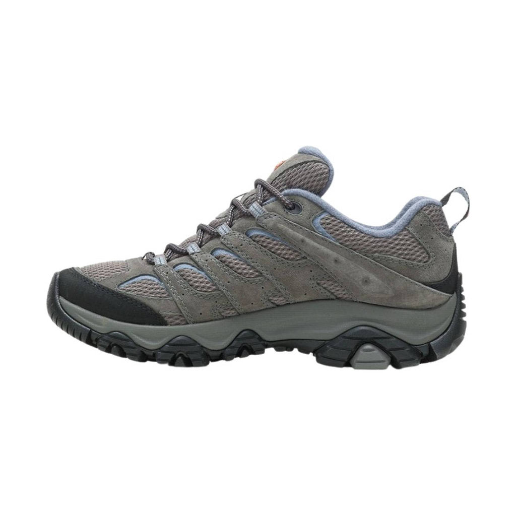 Gray hiking shoe with black sole on a white background