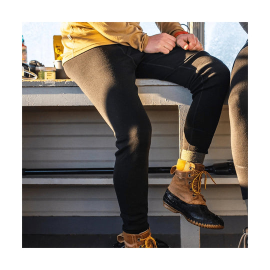Black thermal leggings worn with hiking boots