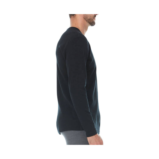 Black long-sleeve crewneck shirt shown in side profile