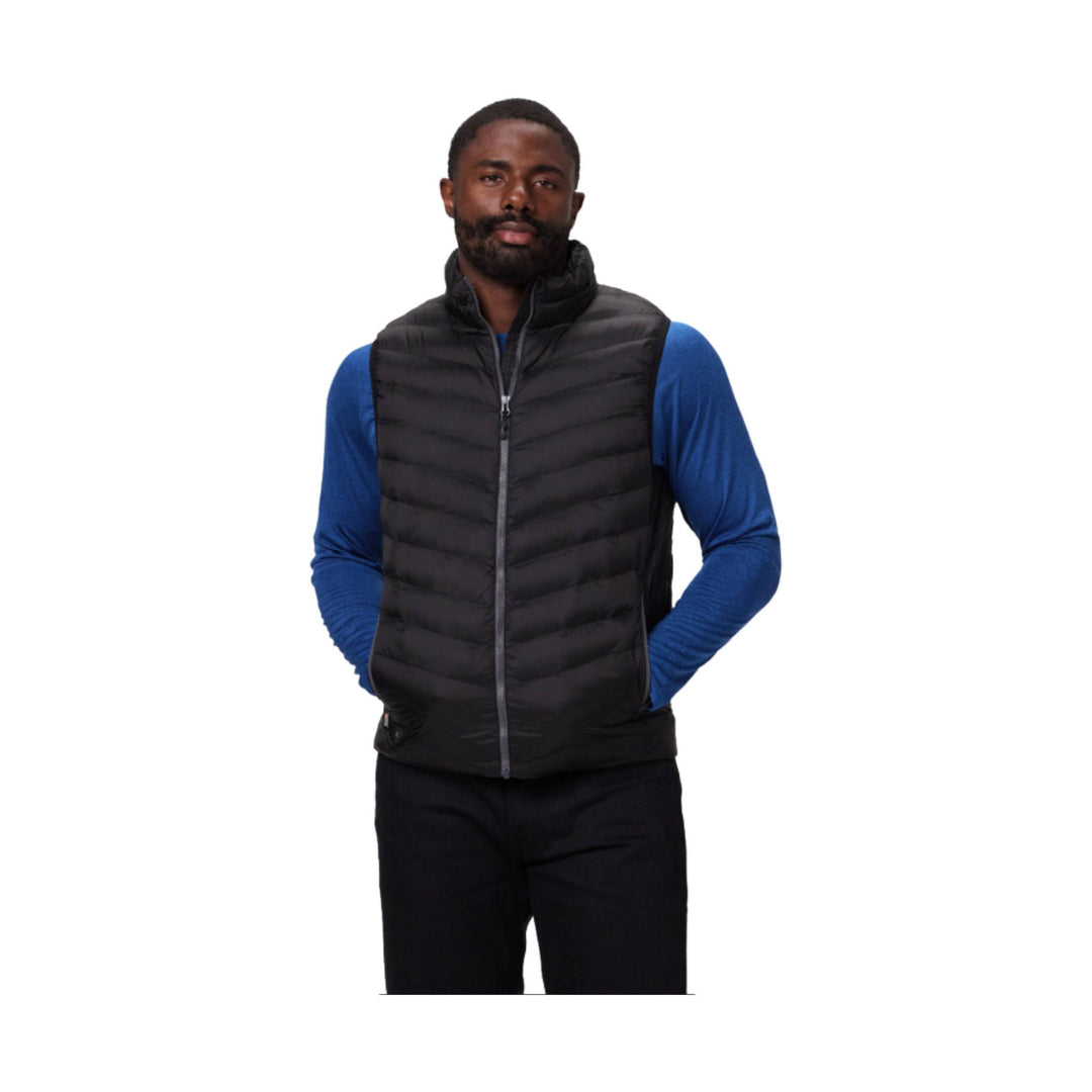 Black zip-front quilted heated vest worn over a blue long-sleeve shirt