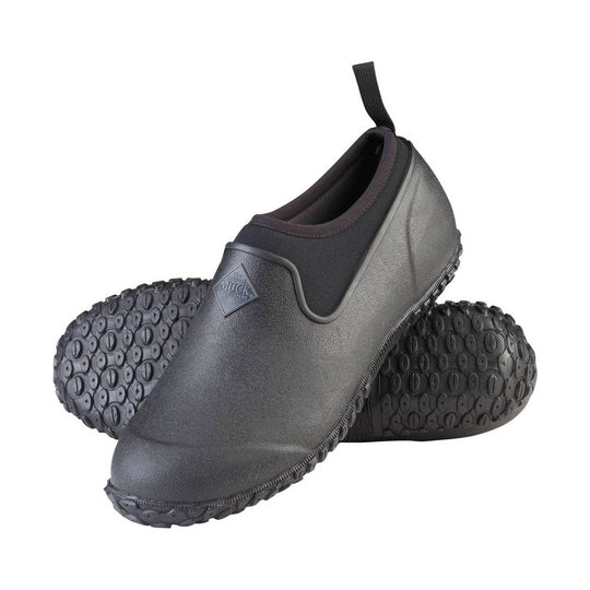 Pair of gray rubber shoes with black soles on a white background