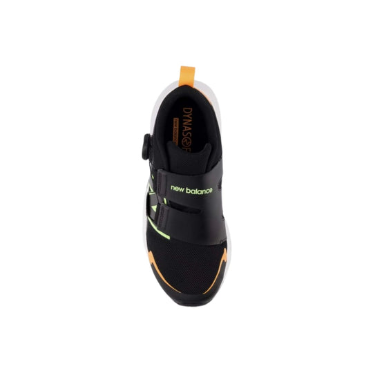 Black kids' athletic shoe with two hook-and-loop straps, lime accents, and an orange pull tab, top view