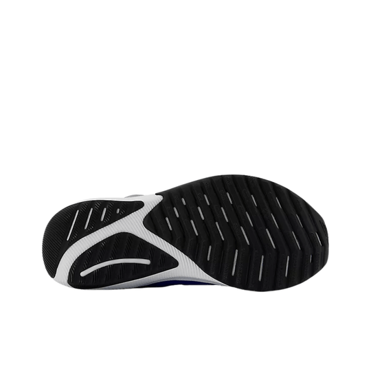 Black and white athletic shoe outsole with deep tread grooves