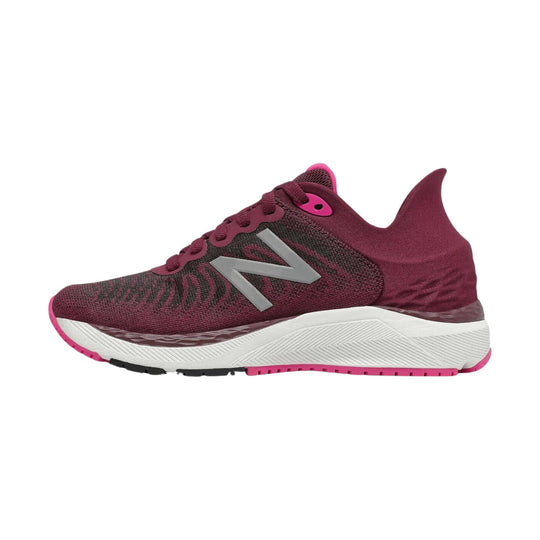 Maroon and pink kids' running shoe with gray side logo, white midsole, and pink outsole