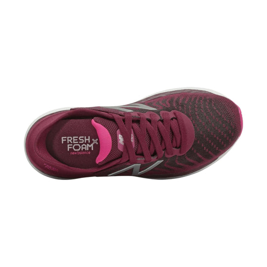 Maroon running shoe with pink trim, laces, and knit upper, shown from above