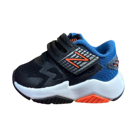 Kids' athletic sneaker in black and blue with orange accents and a thick white sole