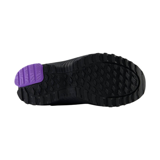 Black sneaker outsole with deep tread and a purple toe grip