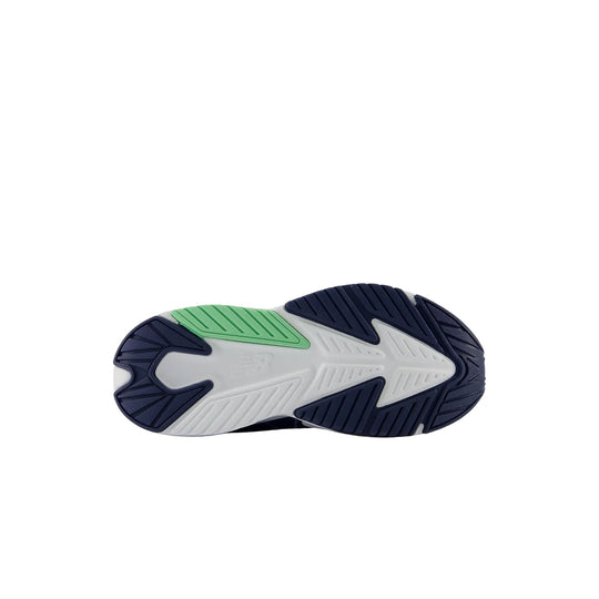 Kids sneaker outsole in navy, white, and green with a bold arrow tread pattern
