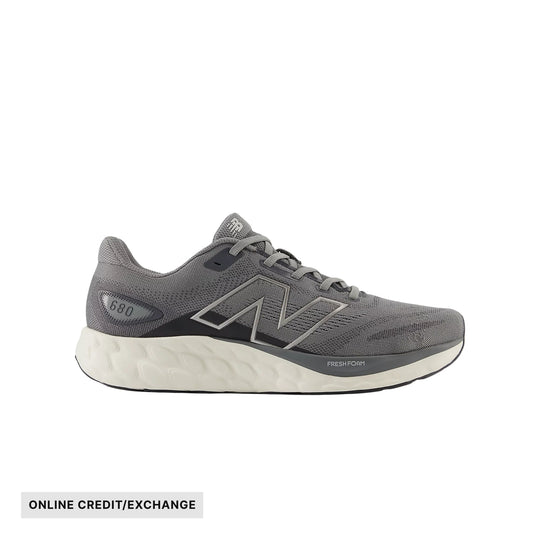Gray running shoe with white foam sole and side logo, shown in profile with ONLINE CREDIT/EXCHANGE text