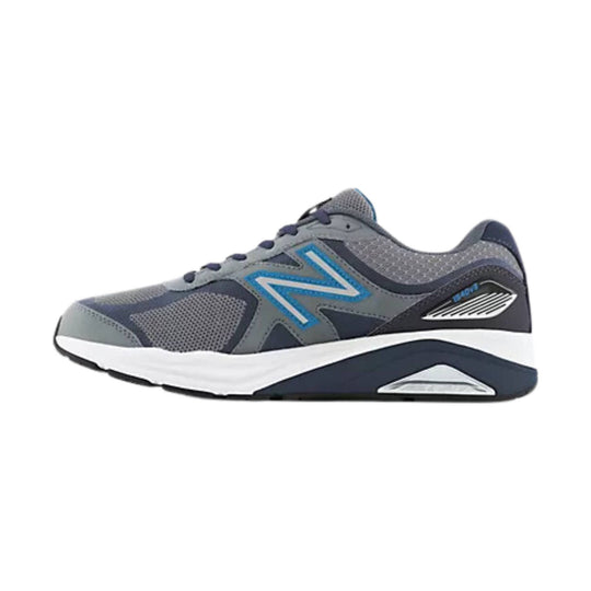 Gray and navy athletic running shoe with blue side logo and white midsole, side view