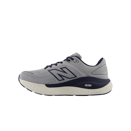 Gray running shoe with navy accents and a large side logo, shown in profile