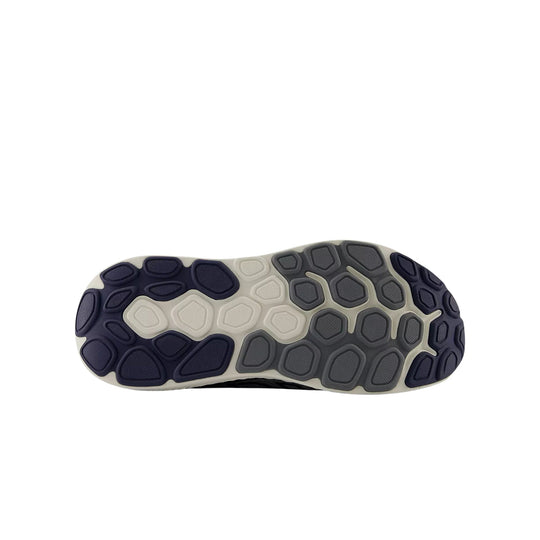Grey and navy running shoe outsole with segmented tread pattern