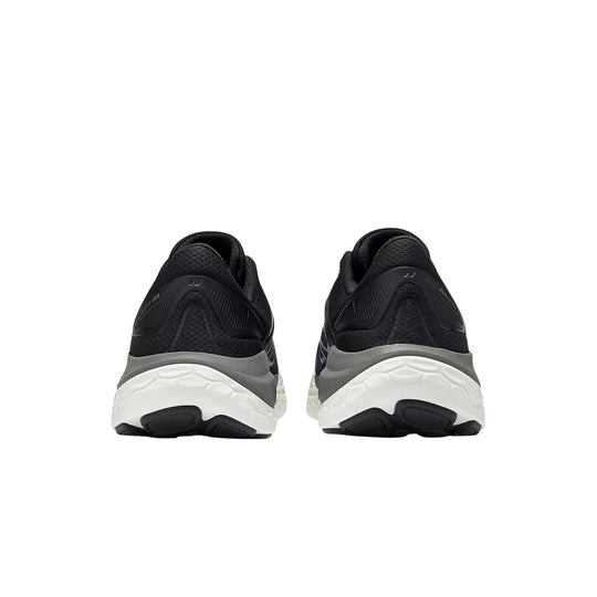 Black and gray running shoes shown from the back with thick white midsoles and black outsoles