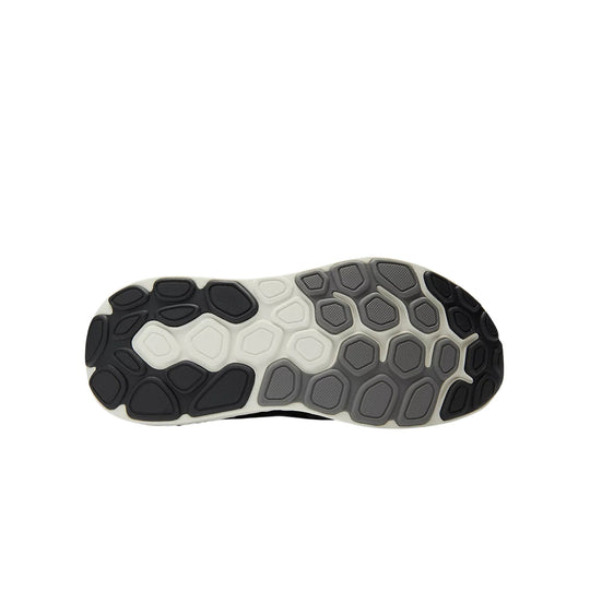 Black, gray, and white running shoe sole with segmented tread pattern