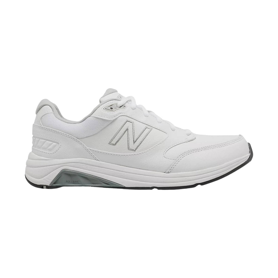 White low-top walking shoe with mesh panels, lace-up closure, and gray sole details