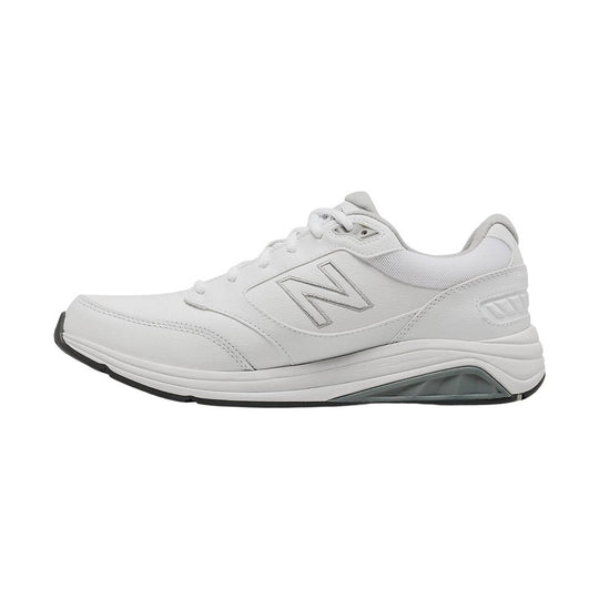 White athletic walking shoe in side view with a large stitched N logo, mesh collar, and thick cushioned sole