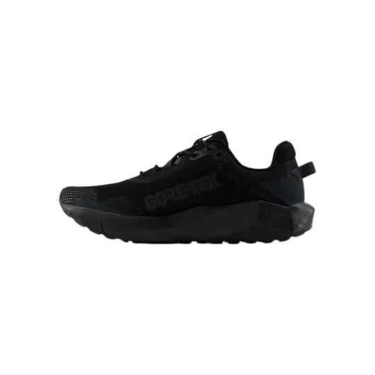 Black low-top hiking shoe with thick sole and textured toe cap, side view