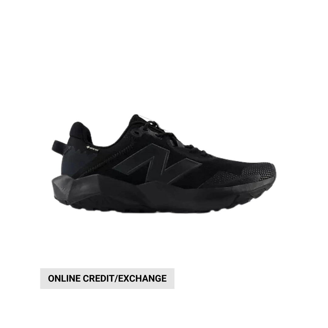 Black low-top hiking shoe with chunky sole and side logo, shown in profile
