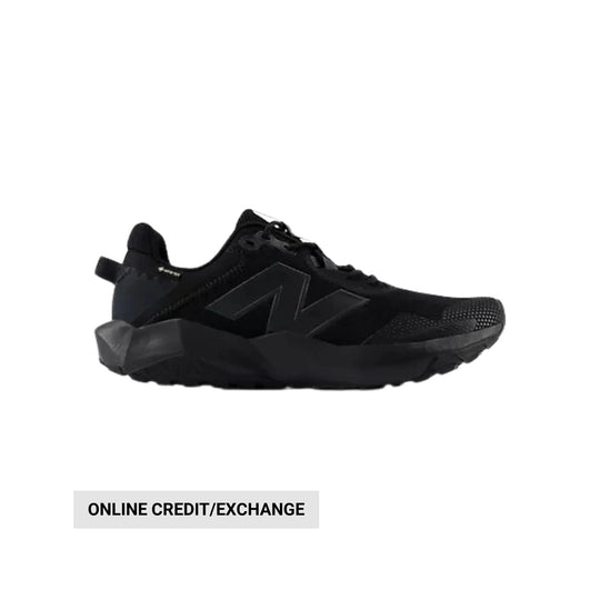 Black low-top hiking shoe with chunky sole and side logo, shown in profile