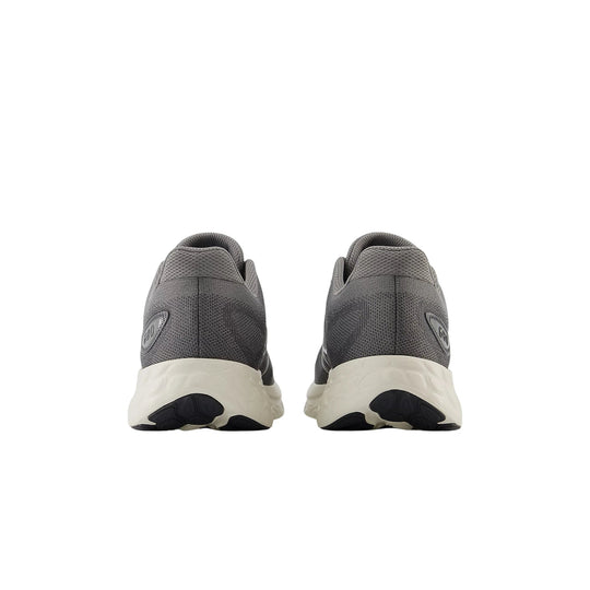 Gray running shoes shown from the back with white foam midsoles and black outsoles
