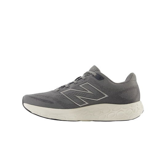 Gray running shoe with a white foam midsole and large side logo