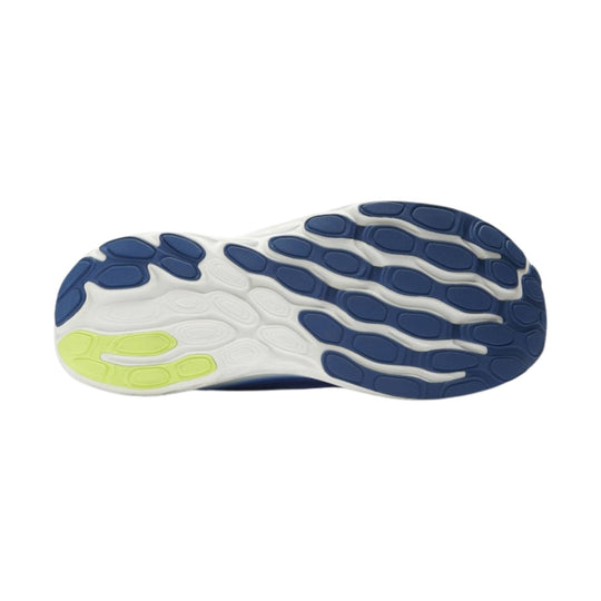 White athletic shoe outsole with dark blue traction pods and a neon yellow forefoot section