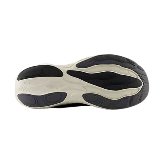 Black and white running shoe outsole with rounded tread pods