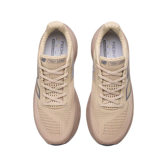 Beige mesh running shoes with laces, perforated uppers, and FRESH FOAM X 1080 branding, shown from above.