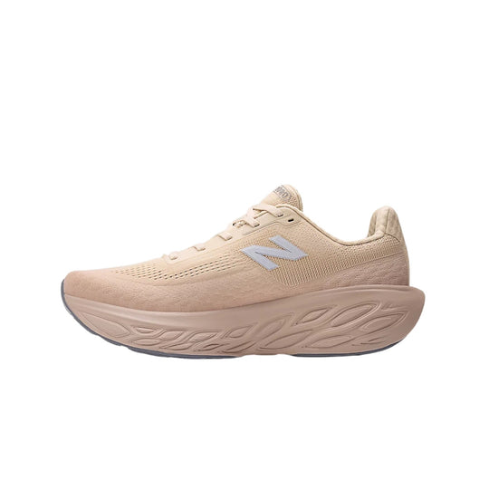 Beige New Balance running shoe in side view with thick sculpted sole and visible N logo