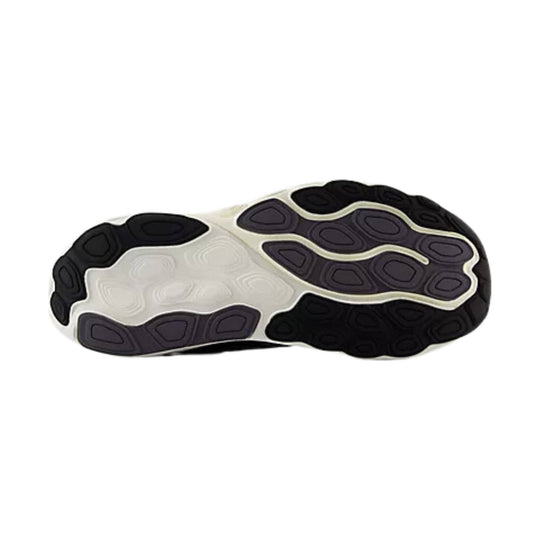 Black, white, and purple running shoe outsole with segmented traction pods