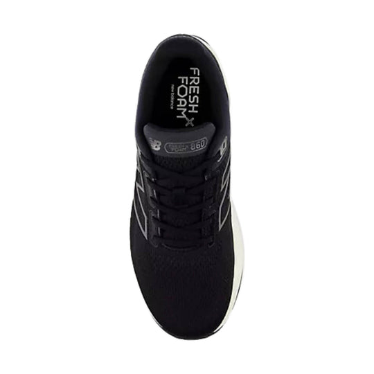 Black running shoe with white side logo and printed tongue label, viewed from above