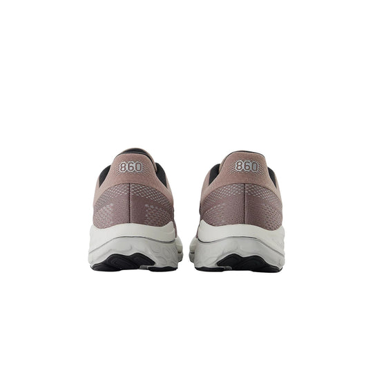 Pair of taupe and black running shoes shown from the back with white midsoles and "860" on the heels