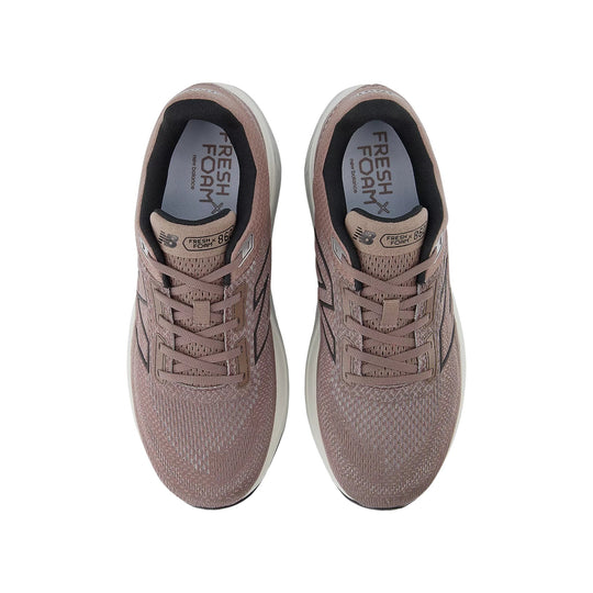Pair of rose taupe running shoes with knit uppers, laces, and visible Fresh Foam insoles