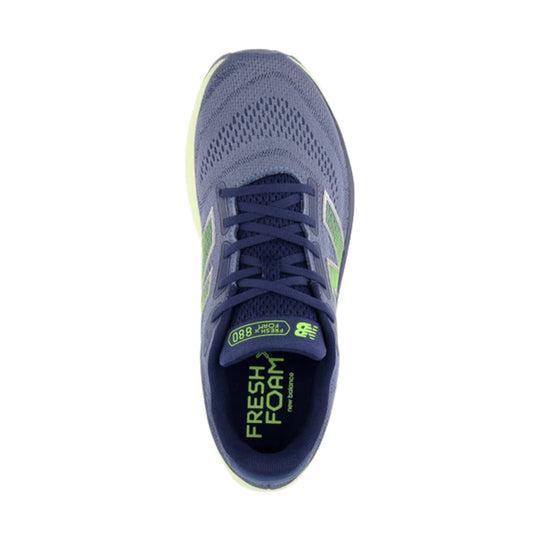 Blue running shoe with lime green accents, top view