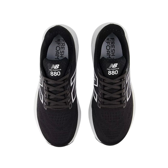 Black running shoes with white side logos, seen from above
