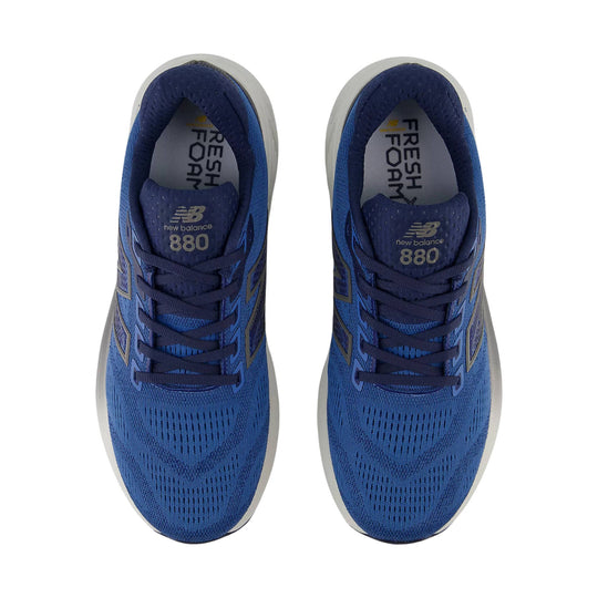Blue running shoes with white midsoles, dark laces, and visible New Balance 880 branding