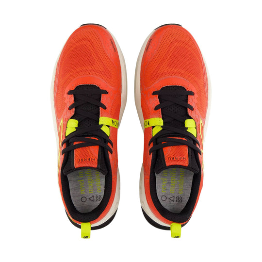 Bright orange trail running shoes with black laces, neon yellow accents, and visible heel pull tabs