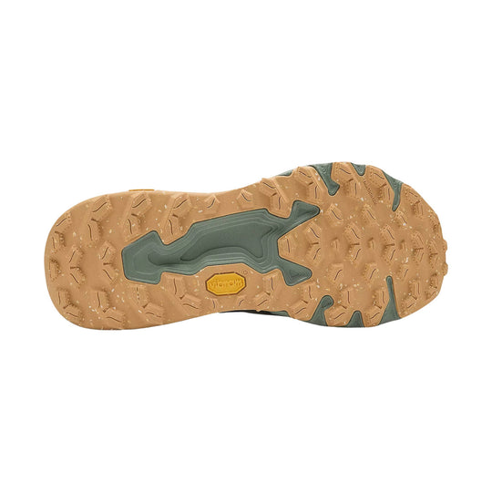 Trail shoe outsole with tan rubber tread and dark green traction inserts
