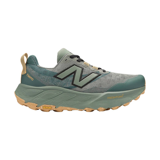 Gray and teal trail running shoe with black laces, gum outsole, and visible brand logos