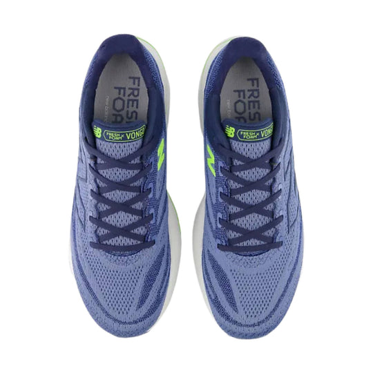 Pair of blue running shoes with lime accents and dark laces, viewed from above