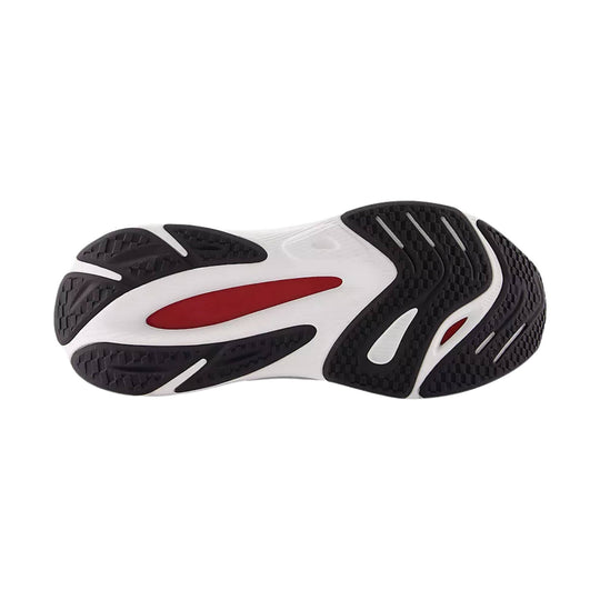 Black and white shoe outsole with red accent panels and textured traction tread