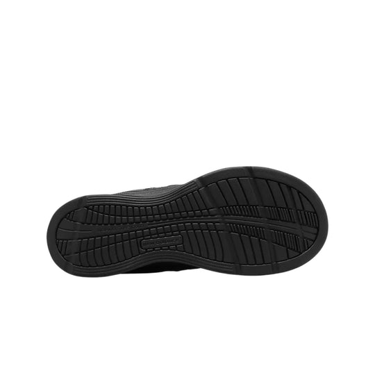 Black shoe outsole with tread pattern and visible New Balance branding