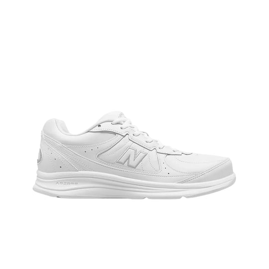 White low-top walking sneaker with stitched panels, lace-up closure, and cushioned sole