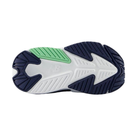 Toddler sneaker outsole with navy traction pods, a white midsole, and a mint green grip section