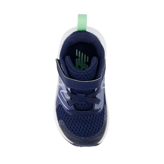 Navy toddler sneaker with bungee laces, top strap, and mint heel pull tab, shown from above