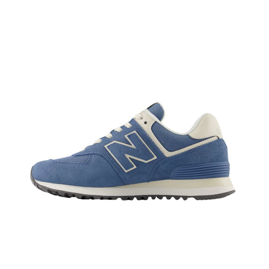 Blue low-top sneaker with white trim, white laces, and a thick cream midsole