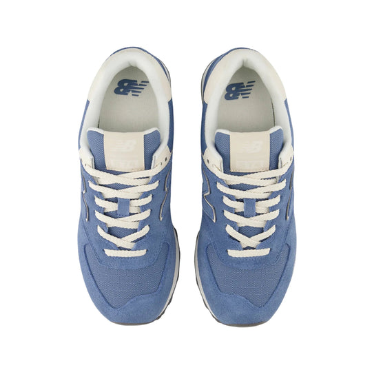 Light blue New Balance sneakers with white laces, white collars, and visible NB logos on the insoles and tongue