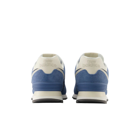 Pair of blue and cream New Balance sneakers shown from the back with embossed heel logo