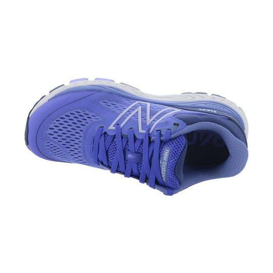 Purple New Balance running shoe with mesh upper, white midsole, and visible logo on the side