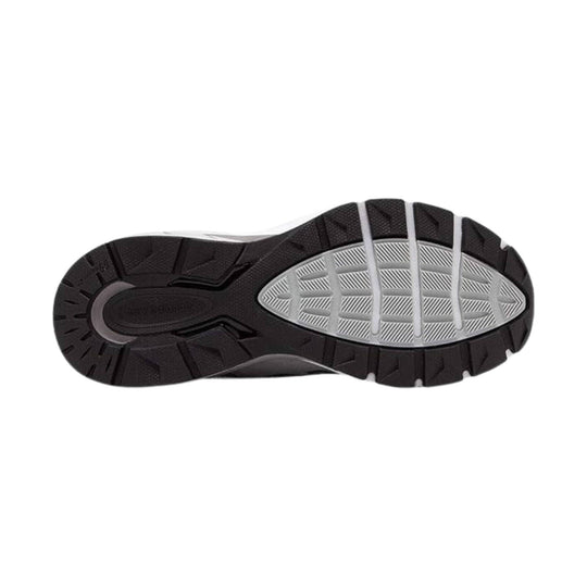 Black and gray sneaker outsole with deep tread and oval midfoot traction panel